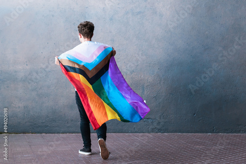 Excited transgender person with LGBT flag