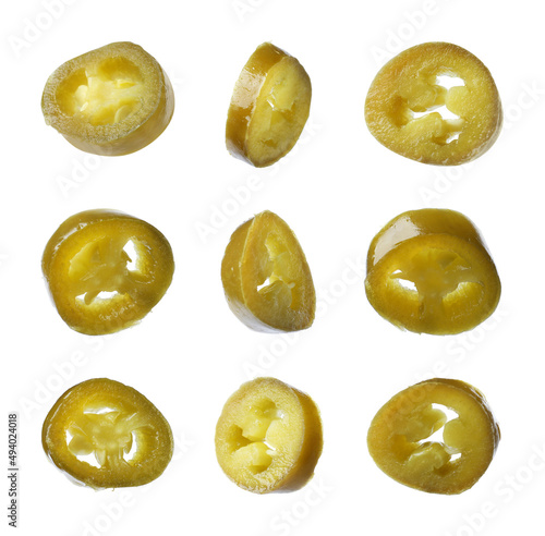 Set with pickled green jalapeno peppers on white background
