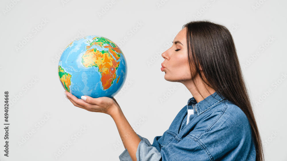 Geography concept. Caucasian young woman eco-activist hugging embracing kissing Earth globe with care, protecting planet from contamination, garbage, traveling abroad isolated in white background Geography concept. Caucasian young woman eco-activist hugging embracing kissing Earth globe with care, protecting planet from contamination, garbage, traveling abroad isolated in white background