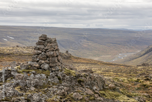 Canvas Print Pyramid made out of stones on the hill against a cloudy sky in Iceland