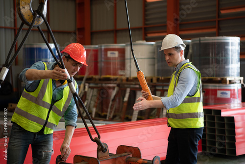 Two young engineers Testing and checking the operation of the semi gantry crane photo