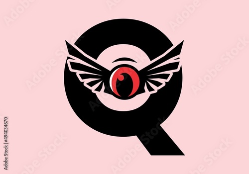 Q initial letter with red eye wings