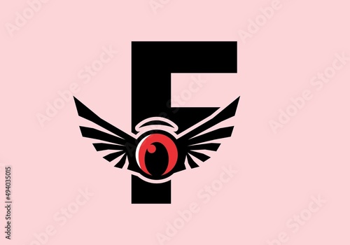 F initial letter with red eye wings