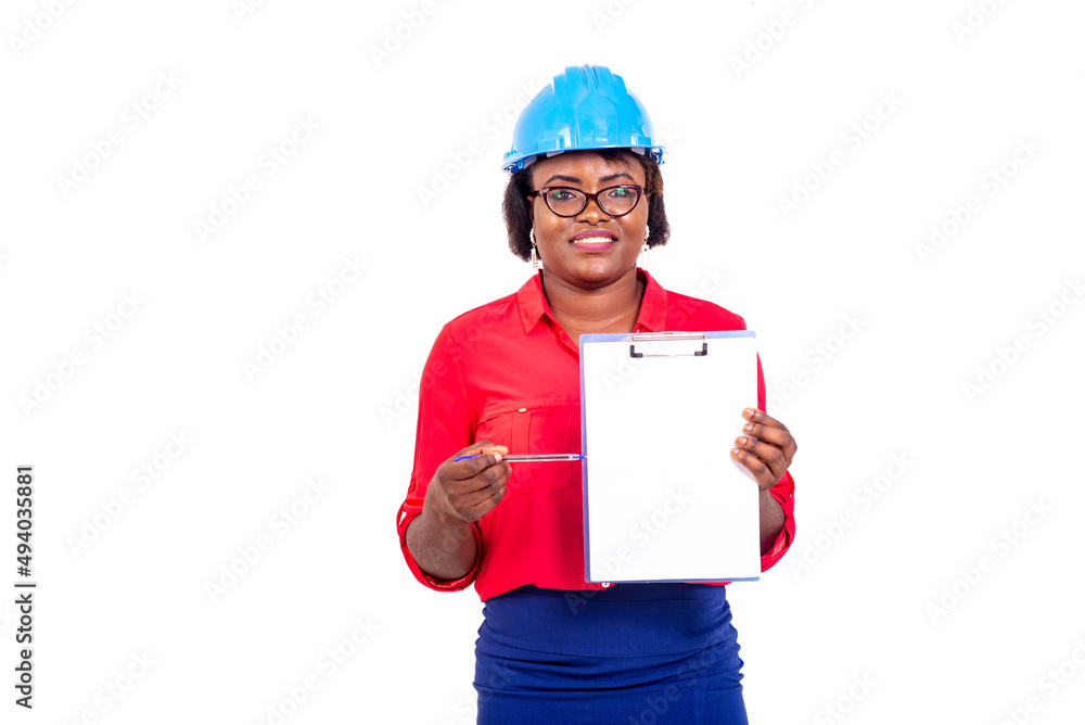 beautiful female engineer is presenting something on clipboard smiling. beautiful female engineer is presenting something on clipboard smiling.