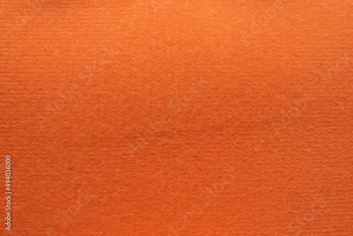 The Orange flannel laid on the floor in Top View is a beautiful felt fabric backdrop and is perfect for designs for use with text and other designs. texture of Orange flannel background image