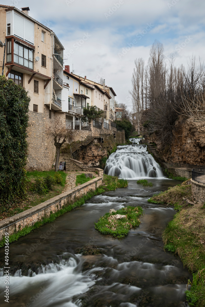 Waterfalls of the Cifuentes river flowing through the Spanish village of Trillo