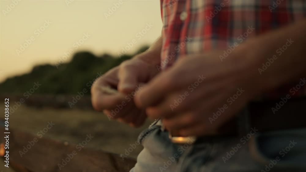 Man hands with wheat spikelets at golden sunset. Farmer check grain quality. Man hands with wheat spikelets at golden sunset. Farmer check grain quality.