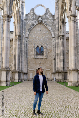 Young boy walking inside the Carmo Convent, in Lisbon - Portugal