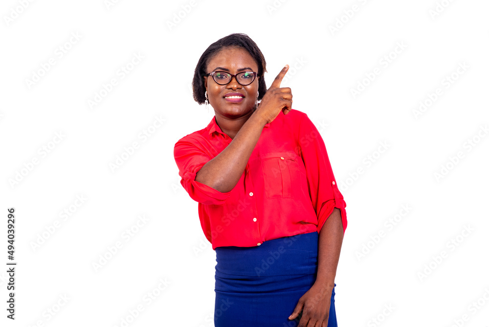 young businesswoman pointing finger aside smiling. young businesswoman pointing finger aside smiling.