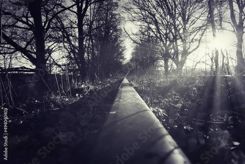 abandoned disused railway line in the morning sun
