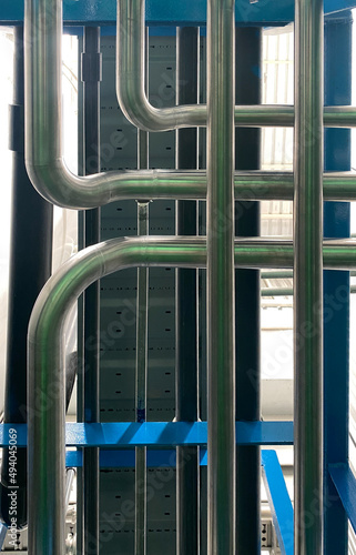 Complex stainless steel pipe It is an industrial equipment for drinking water technology that has been accepted for use in the food industry. It has been installed and placed on a blue iron base.