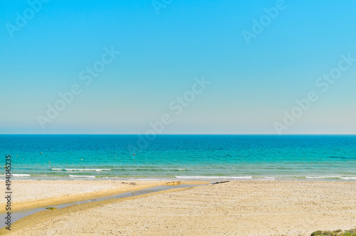 Fototapeta Naklejka Na Ścianę i Meble -  Empty sandy beach and turquoise waters of Mediterranean Sea. Spain