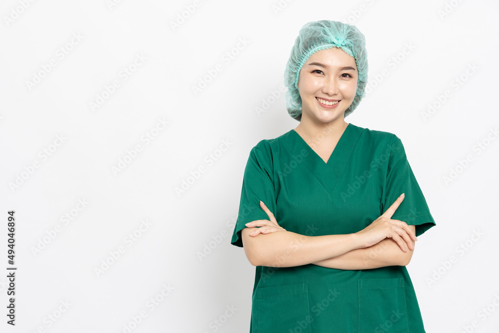 Confident smiling Asian doctor woman, Nurse in scrubs outfit standing with cross arms isolated over white background Confident smiling Asian doctor woman, Nurse in scrubs outfit standing with cross arms isolated over white background