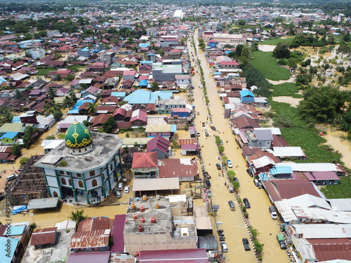 Aerial view of Situation Flood in sangatta city, east kutai, east Kalimantan, Indonesia in 21 March 2022. Floods hit homes and highways, disrupting transportation,  floods because high rainfall. photo