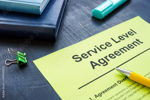 Service level agreement form for signing and pen. photo