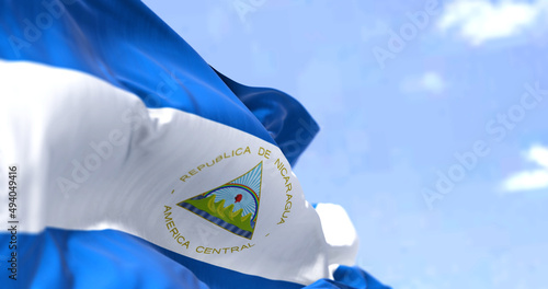 Detail of the national flag of Nicaragua waving in the wind on a clear day photo