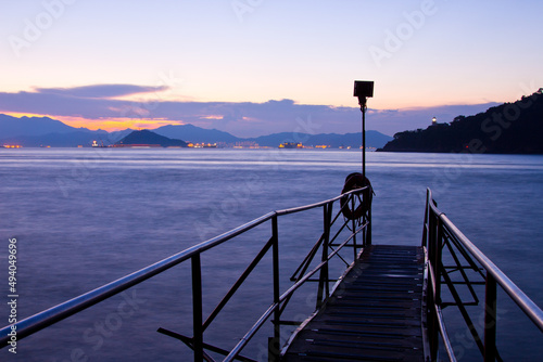 Canvas Print Wooden swimming shed in Kennedy Town, Hong Kong during a late sunset
