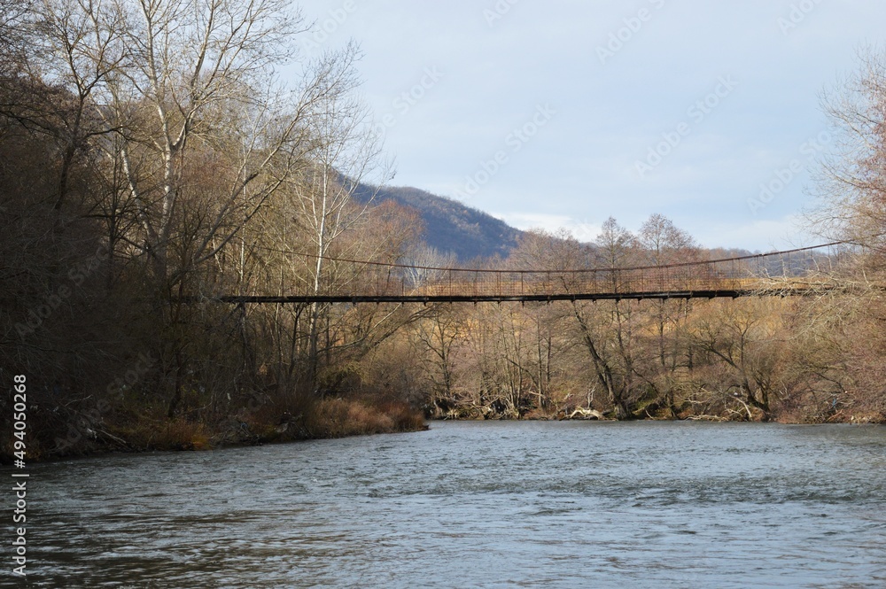 the old suspension bridge over the river