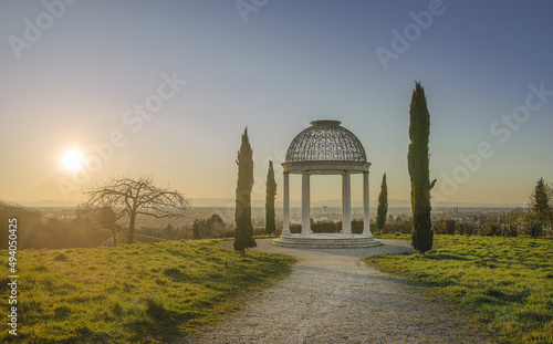 Beautiful view of a gazebo rotunda in a garden photo