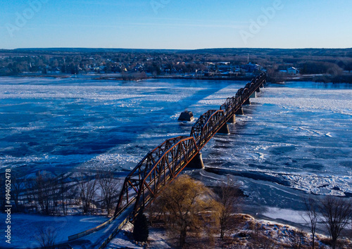 Old train bridge in Fredericton, New Brunswick, Canada in the winter photo