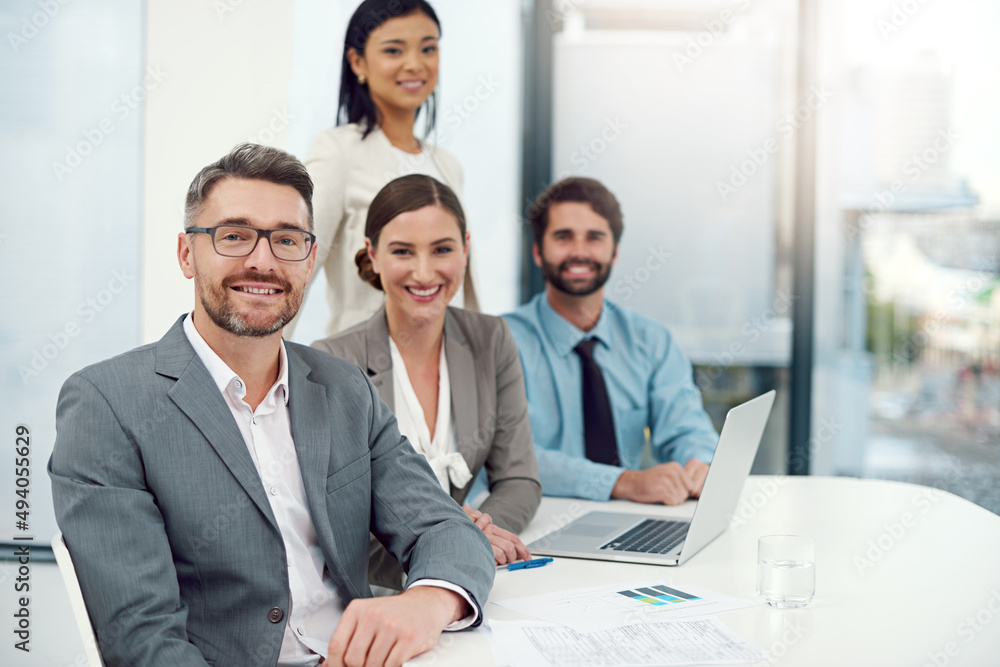 White collar confidence. Portrait of a group of businesspeople working together in a modern office. White collar confidence. Portrait of a group of businesspeople working together in a modern office.