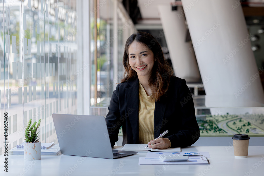 Beautiful Asian woman is a businesswoman who leads a new generation of startups, a woman who runs and manages a business plan to build confidence and stability in business, woman-led business concept. Beautiful Asian woman is a businesswoman who leads a new generation of startups, a woman who runs and manages a business plan to build confidence and stability in business, woman-led business concept.