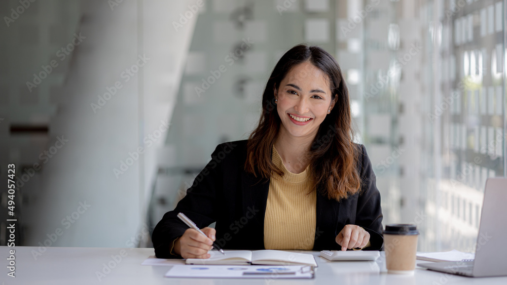 Beautiful Asian woman is a businesswoman who leads a new generation of startups, a woman who runs and manages a business plan to build confidence and stability in business, woman-led business concept. Beautiful Asian woman is a businesswoman who leads a new generation of startups, a woman who runs and manages a business plan to build confidence and stability in business, woman-led business concept.