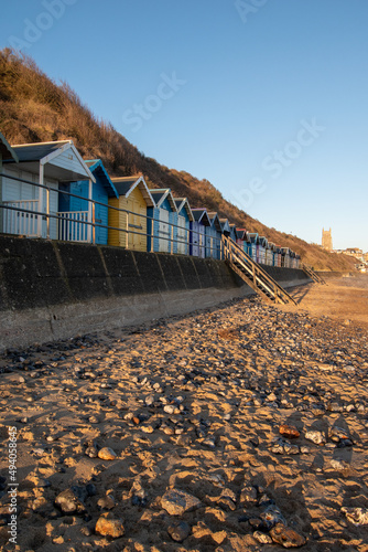 Charming beach huts by the sandy beach in Cromer, north Norfolk, UK. Photographed in January 2022.