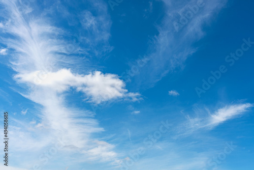blue sky with white cirrus clouds © westermak15