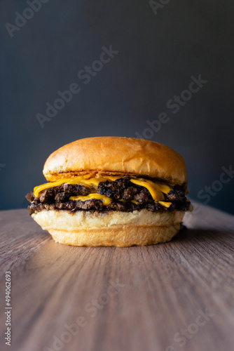 doble cheese burger on wooden table