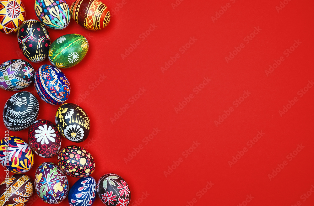 Red Easter card. Beautiful Easter multi-colored eggs on a red background, space for text. Red Easter card. Beautiful Easter multi-colored eggs on a red background, space for text.
