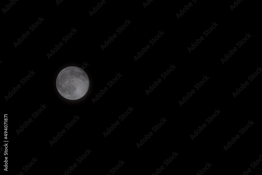 A beautiful image of a full moon captured with an RF Canon 100-500 telephoto lens. Wonderful picture with a great composition of the night sky. A beautiful image of a full moon captured with an RF Canon 100-500 telephoto lens. Wonderful picture with a great composition of the night sky.