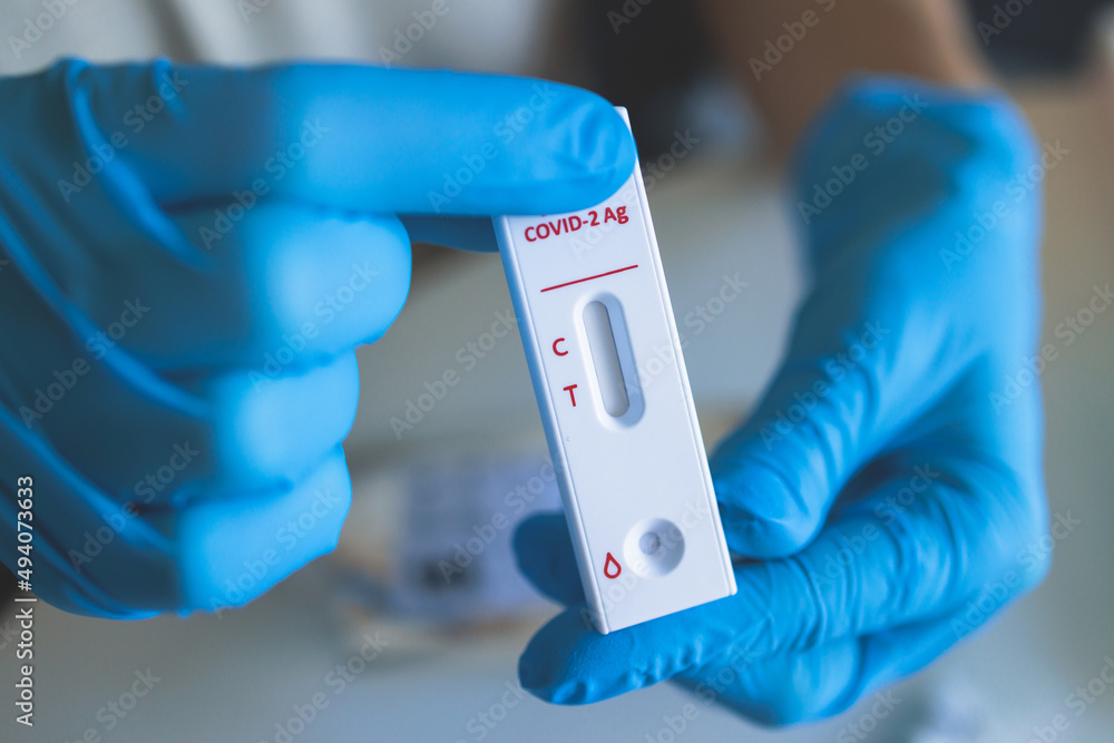 Process of express fast coronavirus covid Antigen AG PCR testing examination at home, COVID-19 swab collection kit, test tube for taking OP NP patient specimen sample, testing carried out