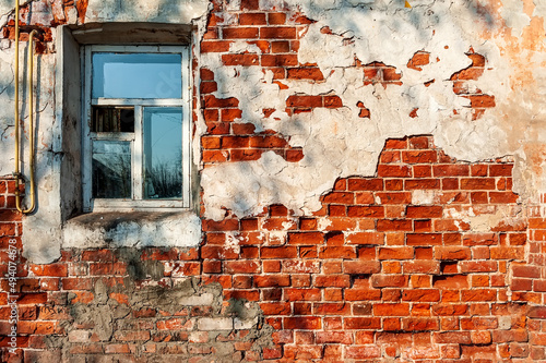 .Old wooden windows on the background of an old brick wall.