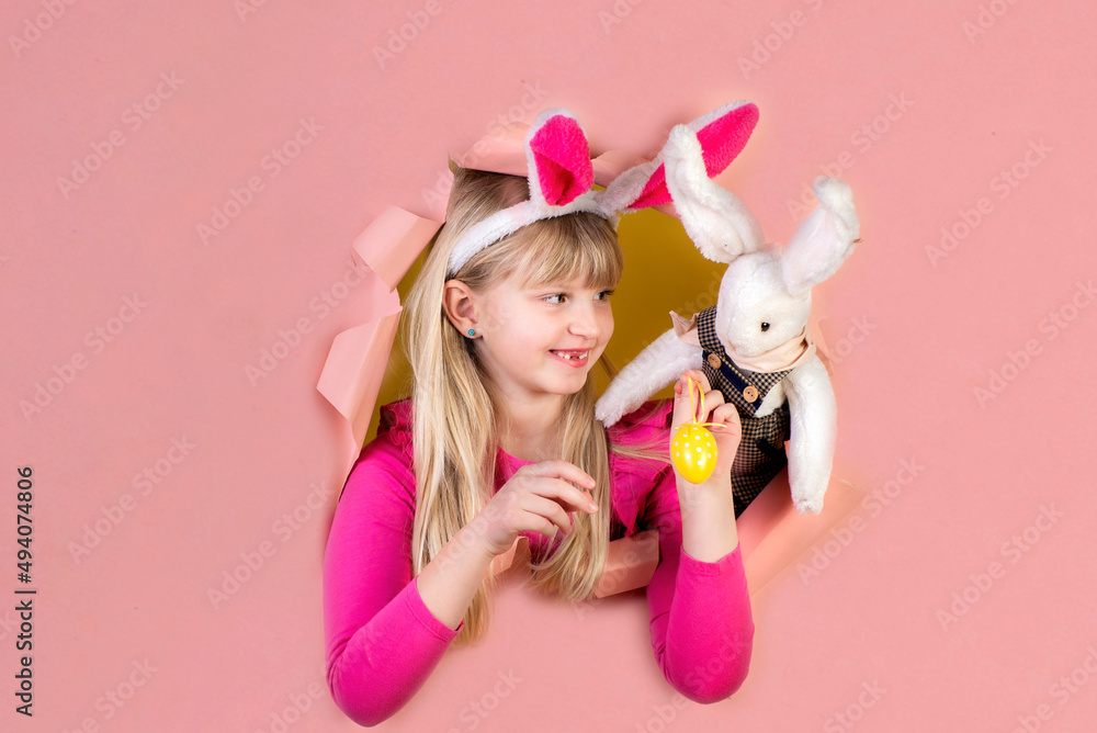 Cute little girl on Easter holiday with a rabbit costume Cute little girl on Easter holiday with a rabbit costume
