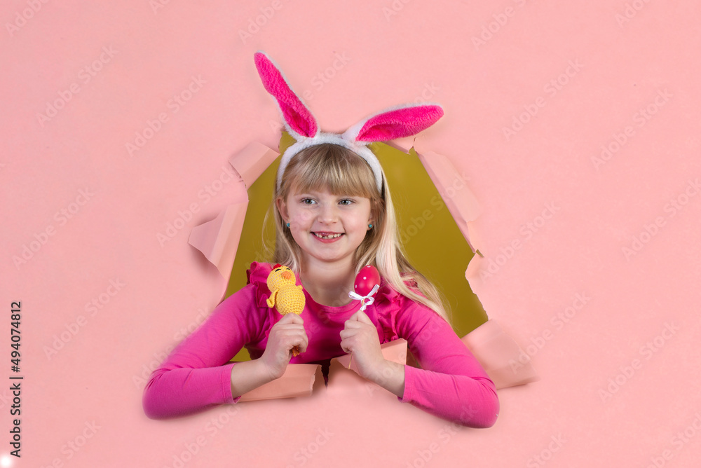 Cute little girl on Easter holiday with a rabbit costume