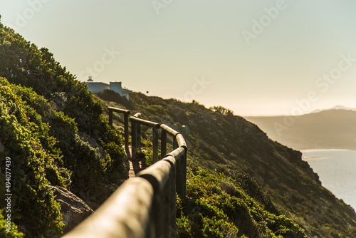 Beautiful shot of a pathway on a hilld under the clear skies photo