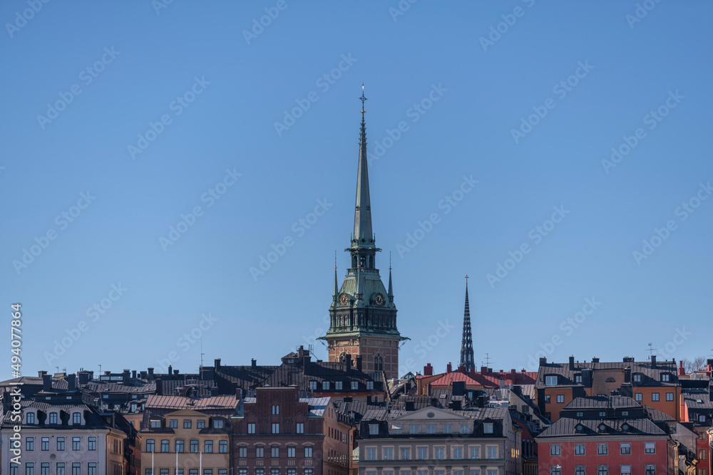 Roof and church towers of the old town Gamla Stan a sunny spring day in Stockholm