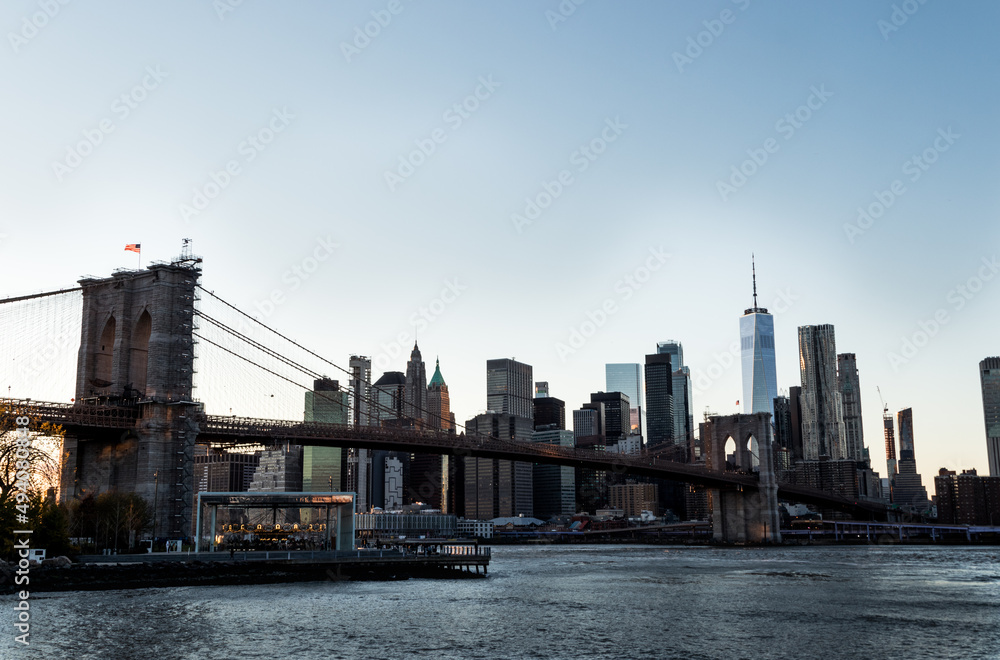 Manhattan's skyline and Brooklyn bridge at DUMBO