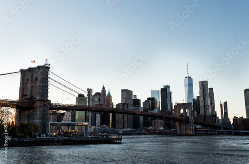 Manhattan s skyline and Brooklyn bridge at DUMBO