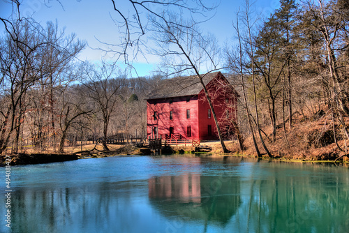 Alley Springs mill in Ozark National Scenic Riverway on a  blue sky background photo