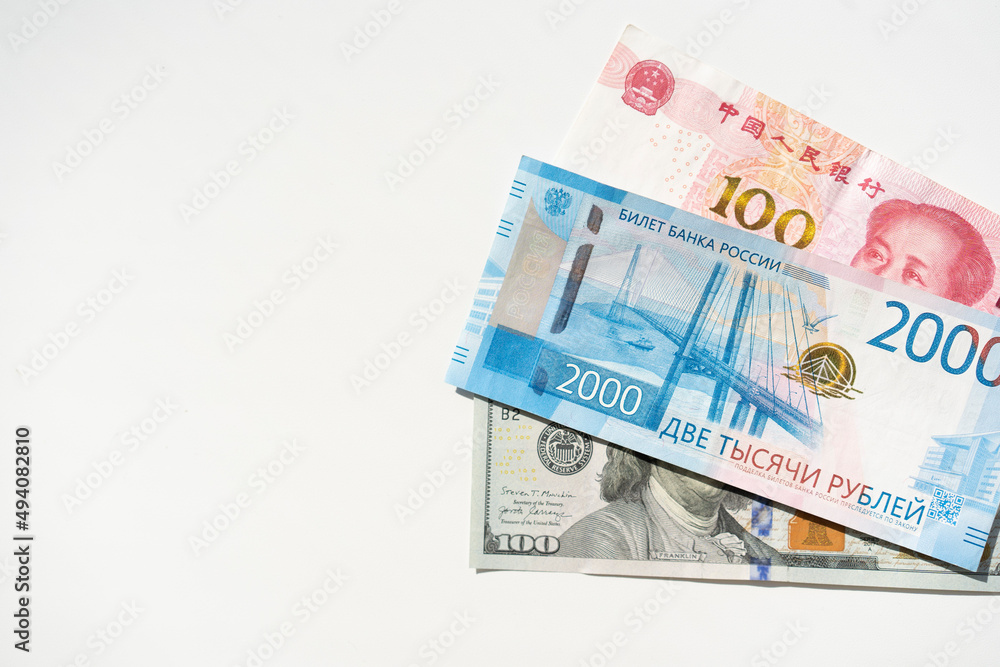 Dollar, ruble and yuan banknotes on the white background. Copy space Dollar, ruble and yuan banknotes on the white background. Copy space