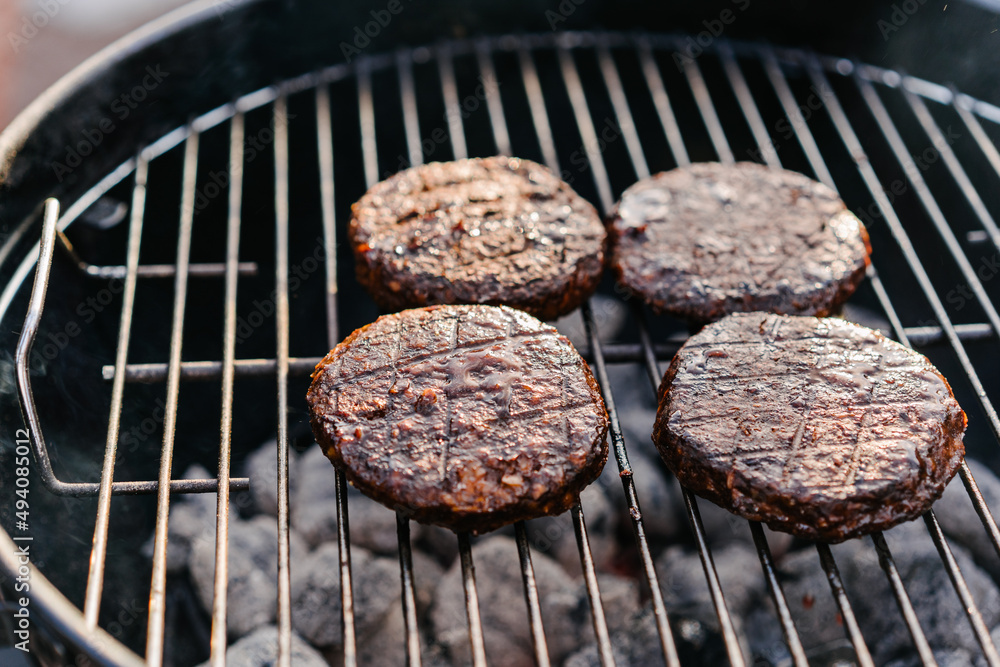 Raw vegan cutlets cooked on the grill outdoors. Plant Based Meat Replacement Raw vegan cutlets cooked on the grill outdoors. Plant Based Meat Replacement