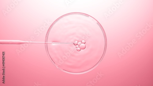 Top view macro shot of air bubbles come out from lab dropper and float on the surface of clear liquid in petri dish bursting on pink background | Abstract skin care product mixing concept