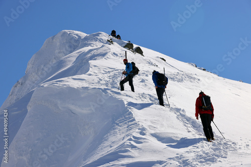 Mountaineers climbing with crampons in the Transylvanian Alps, Romania, Europe