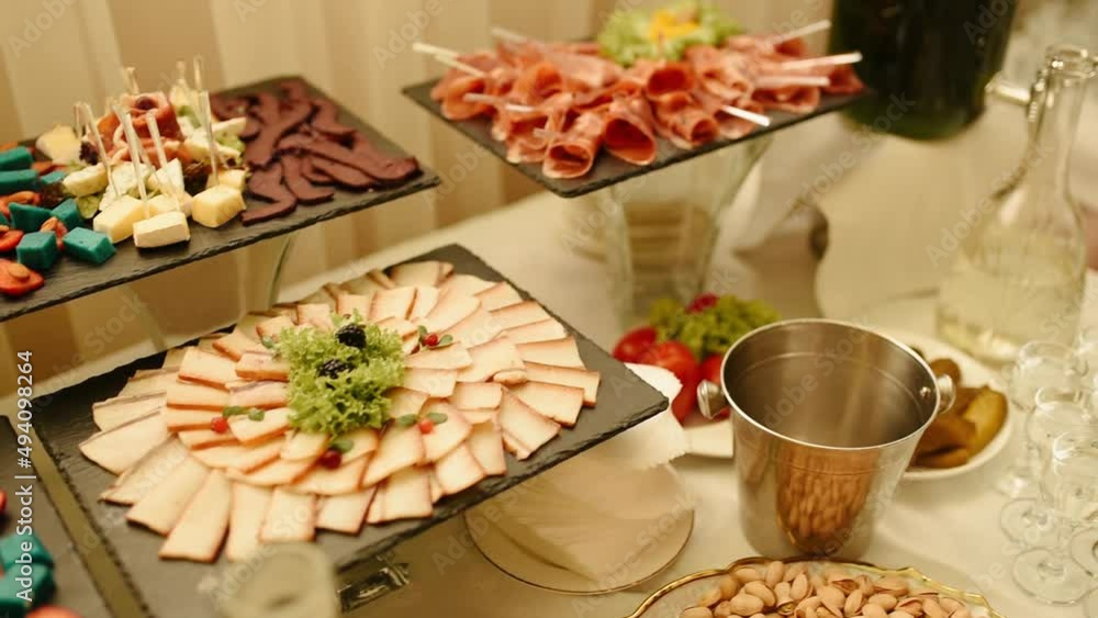 dried meat jamon basturma blue cheese spices herbs seasonings mold.catering buffet food sandwiches slicing meat cheese table setting presentation dishes holiday party wedding in restaraunt cold snack dried meat jamon basturma blue cheese spices herbs seasonings mold.catering buffet food sandwiches slicing meat cheese table setting presentation dishes holiday party wedding in restaraunt cold snack