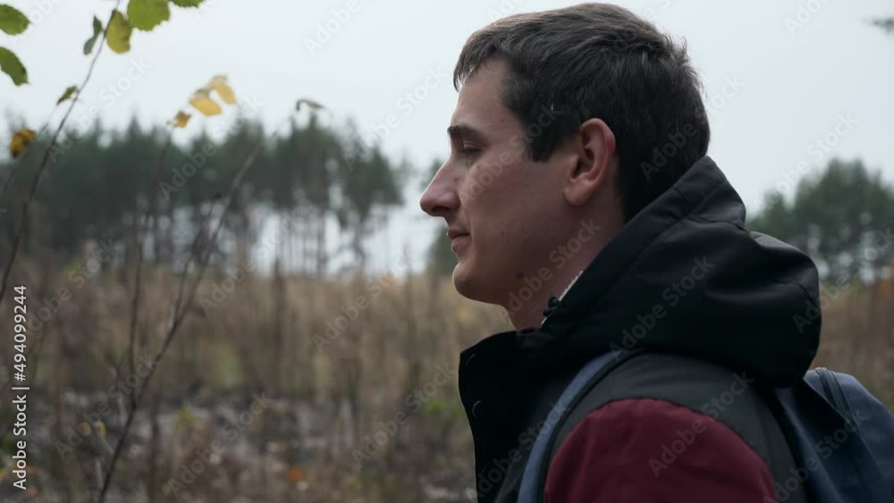 Male Tourist Walk Hike Adventurer Wanderer Trip Man Travel in Forest Wood Nature. Autumn Overcast Day. 2x Slow motion 60fps 4K Male Tourist Walk Hike Adventurer Wanderer Trip Man Travel in Forest Wood Nature. Autumn Overcast Day. 2x Slow motion 60fps 4K