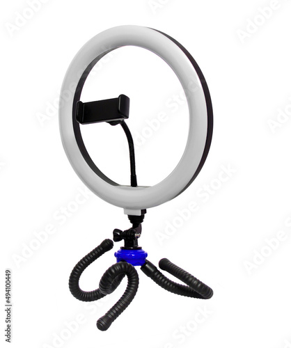 tripod with a lamp for a selfie, on a white background in isolation