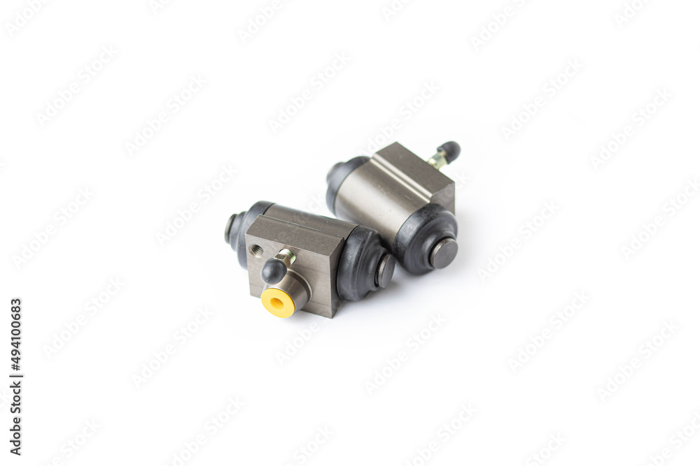 brake cylinders on a white background, brake system spare parts. brake cylinders on a white background, brake system spare parts.