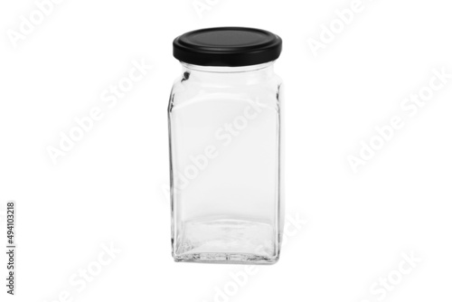 Empty glass jar with black lid isolated on a white background